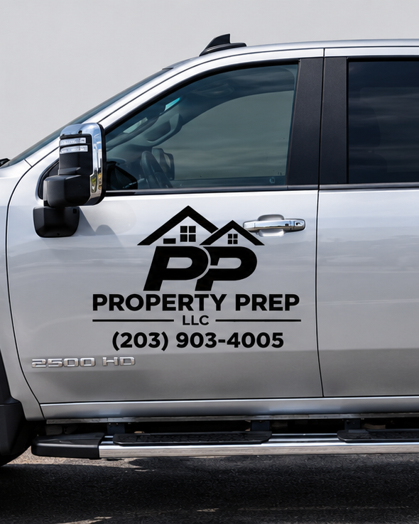 Property Prep LLC logo and phone number decal on the side of our service truck